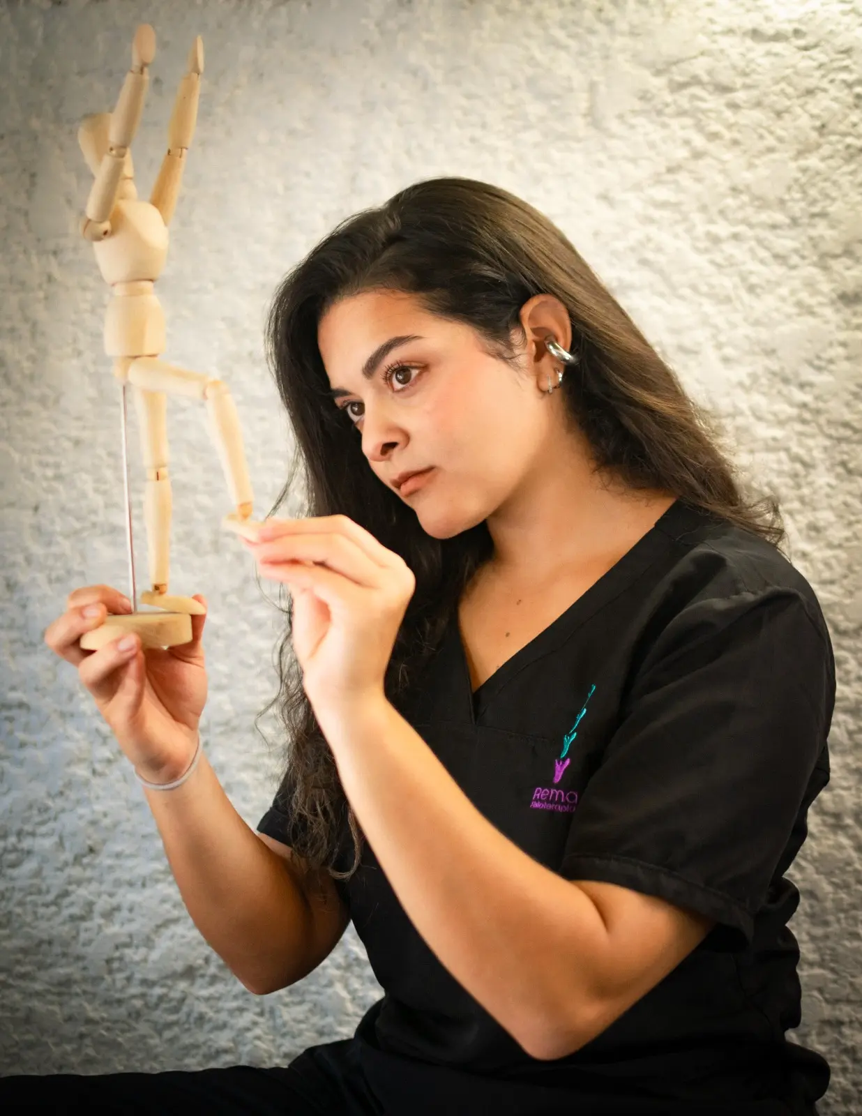 Physiotherapist working with a patient in a bright, modern clinic setting